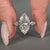 Handmade three stone ring with kite cut side stones.
