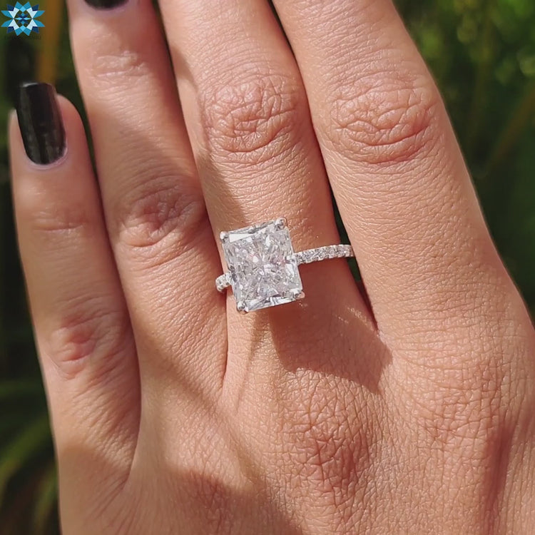 Radiant engagement ring with white gold pave setting.
