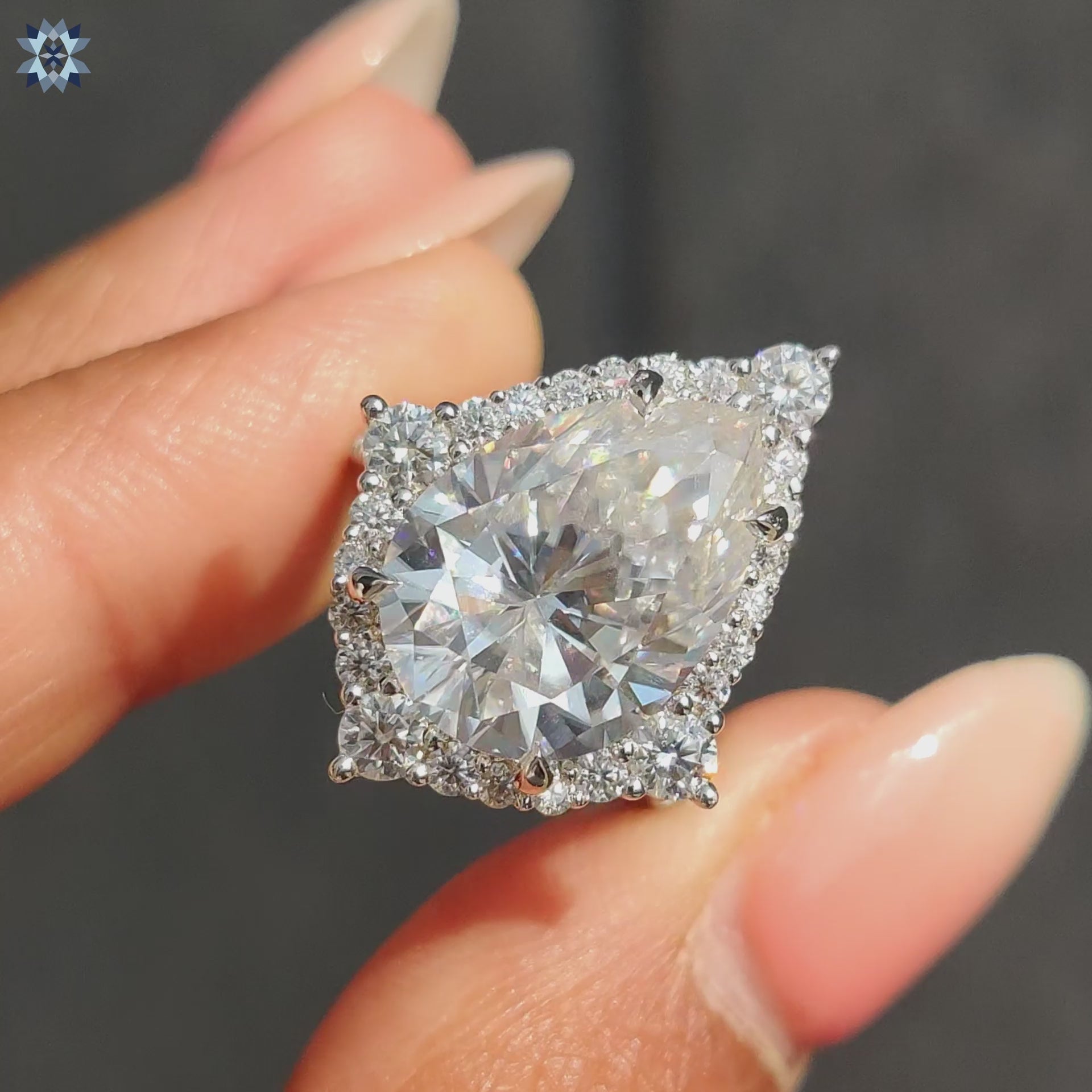 Pear shaped ring with pave setting ring
