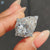 Pear shaped ring with pave setting ring
