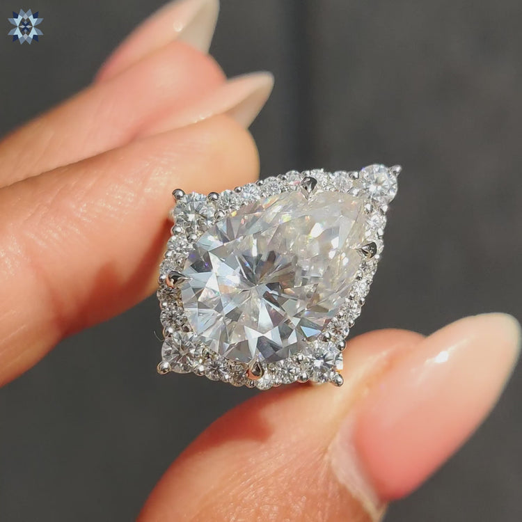 Pear shaped ring with pave setting ring
