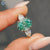 Pear shape ring with three stone ring
