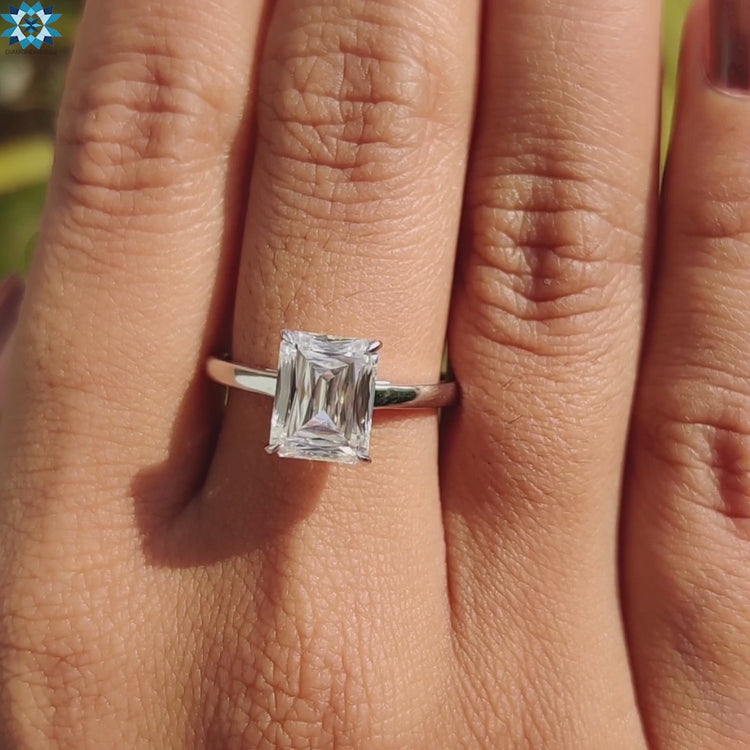 White gold solitaire engagement ring with unique criss cut center.
