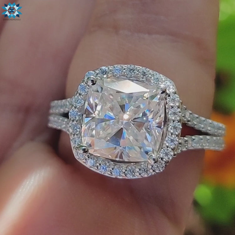 Cushion cut moissanite ring with split shank design.
