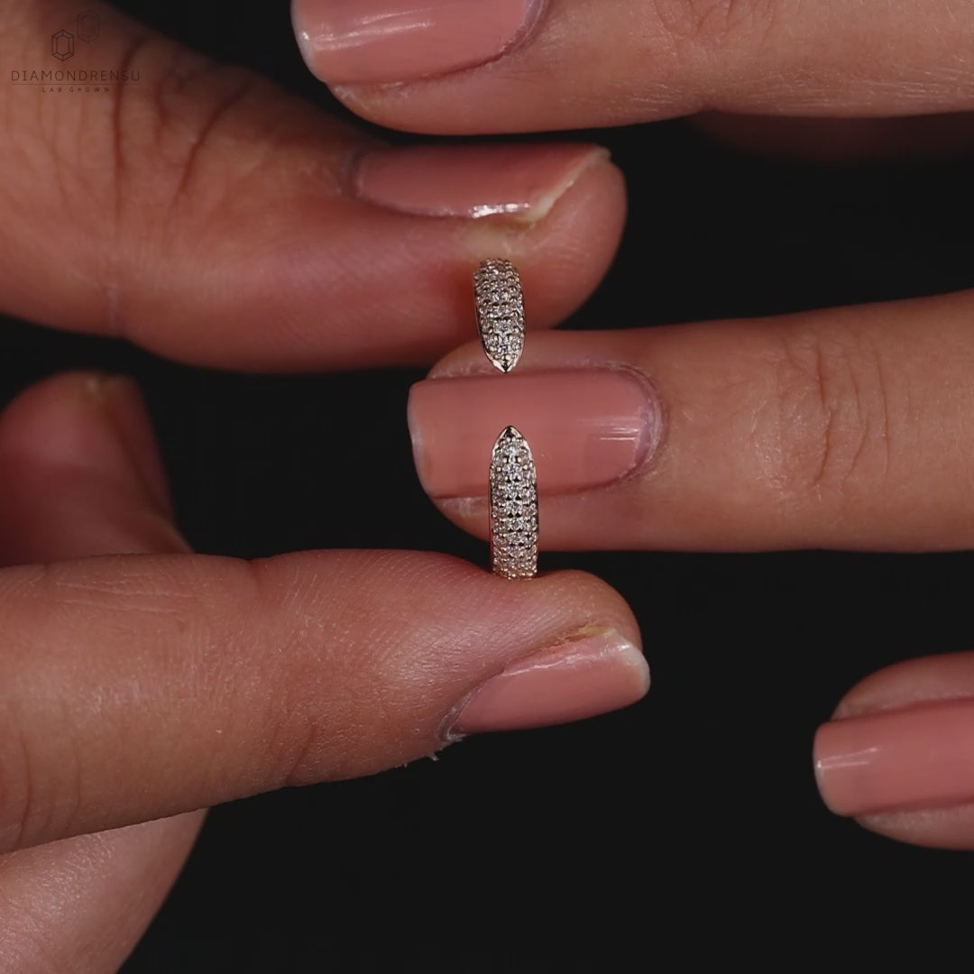 Yellow gold open gap wedding band with pave diamonds.
