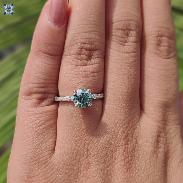 Handmade ring featuring round cut moissanite.
