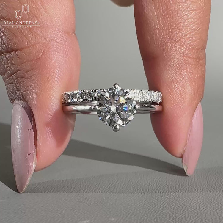 Handmade round cut ring featuring a compass prong setting.
