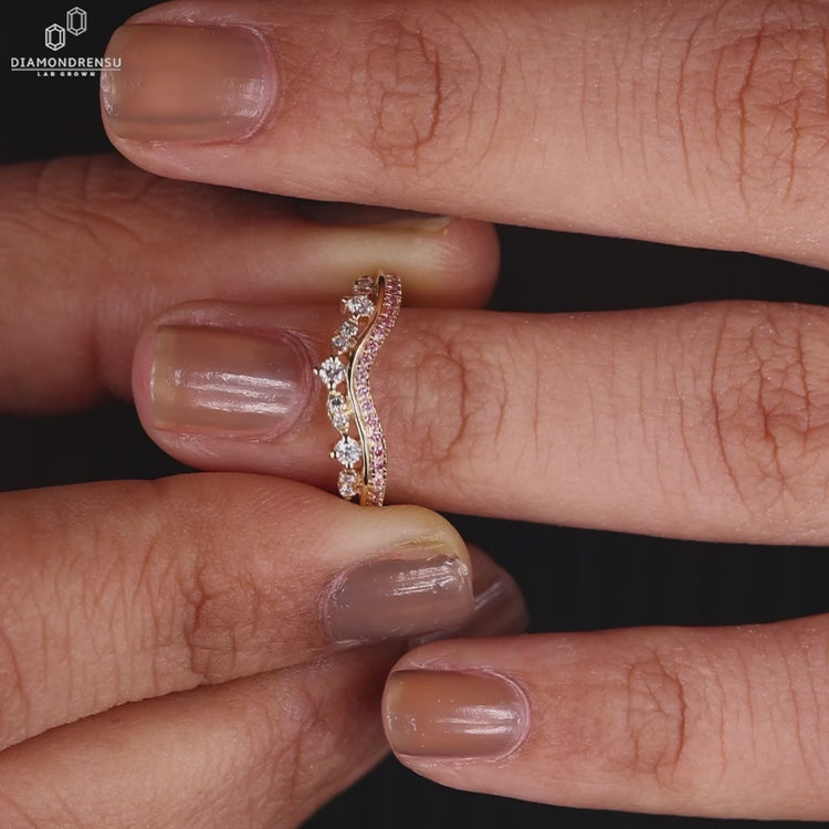 Tiara wedding band with marquise and round cut diamonds.
