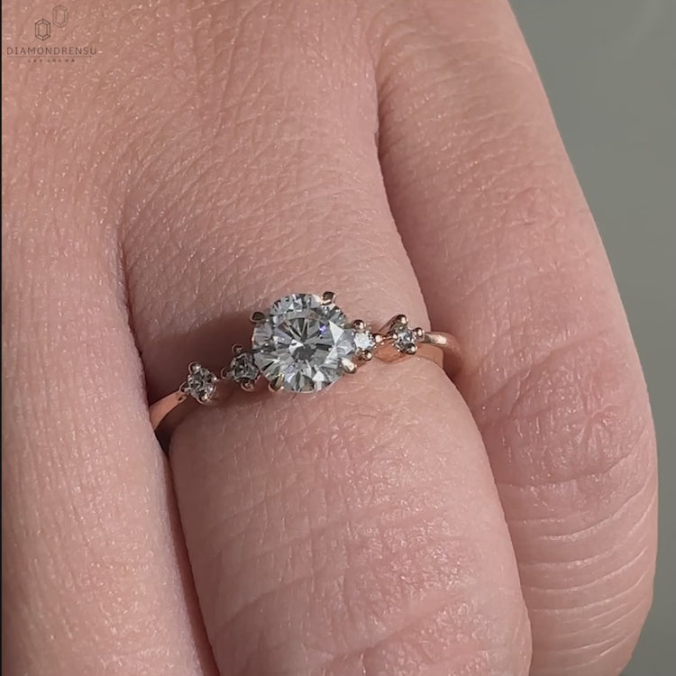 Diamondrensu UK engagement ring with round cut diamond, showcasing a 4 prong claw setting for secure brilliance.
