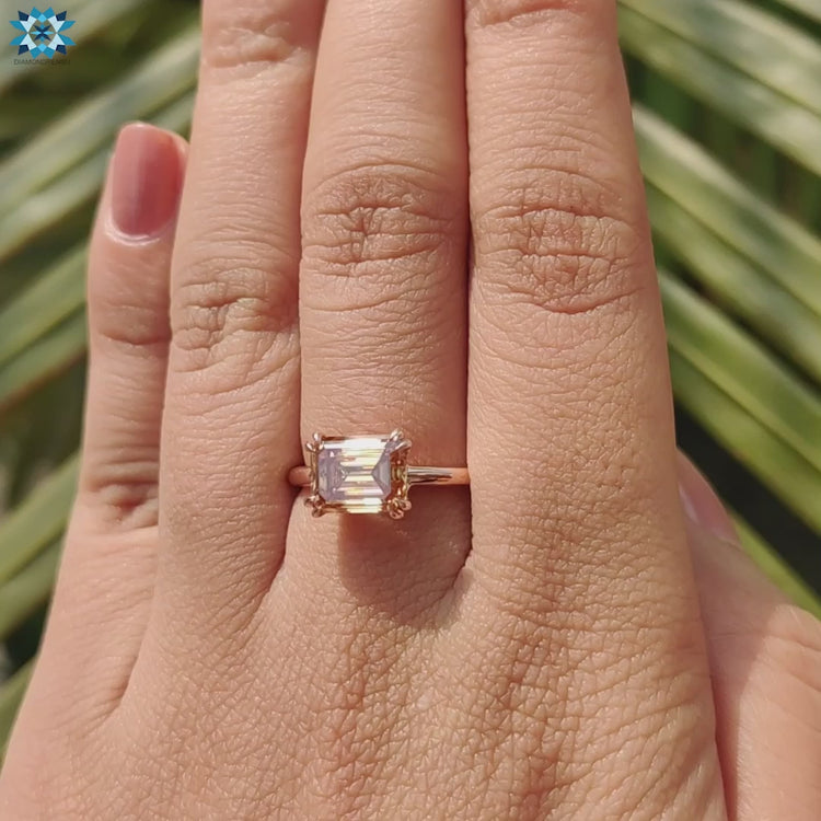 East to west moissanite solitaire in rose gold.
