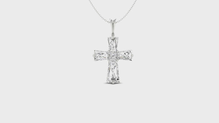 Elegant pendant with cross motif and prong set diamonds.