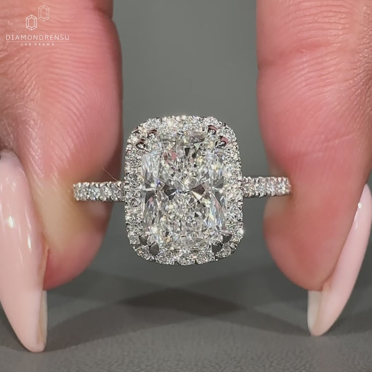 Halo Setting Round Cut Engagement Ring sparkling brilliantly.
