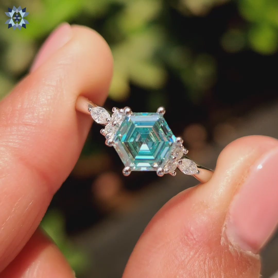 Cyan blue moissanite ring with prong setting
