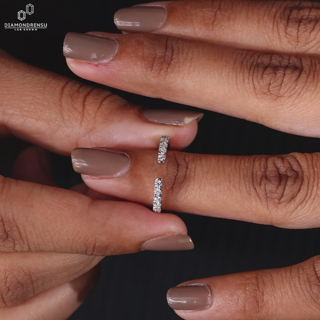Round cut diamond semi eternity wedding band.
