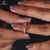 Round cut diamond semi eternity wedding band.
