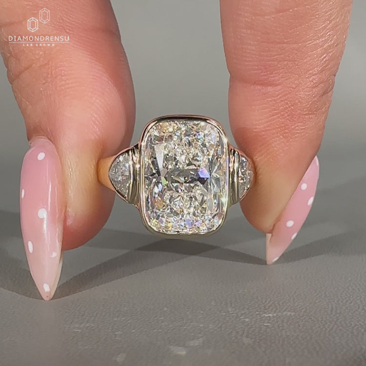 Handmade cushion diamond ring with tapered shank band.