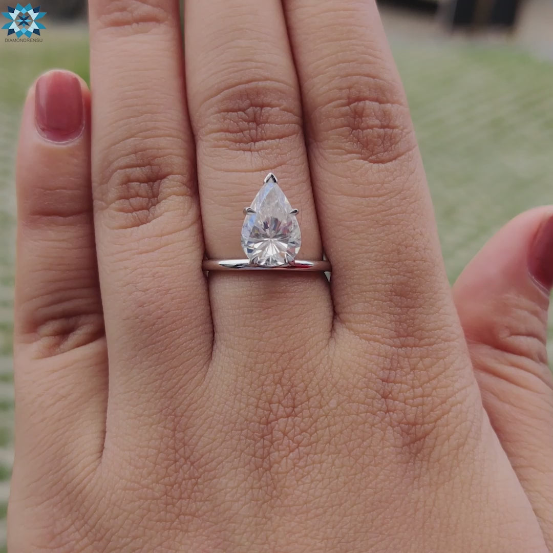 Diamondrensu UK engagement ring featuring a pear moissanite engagement ring in a classic design.