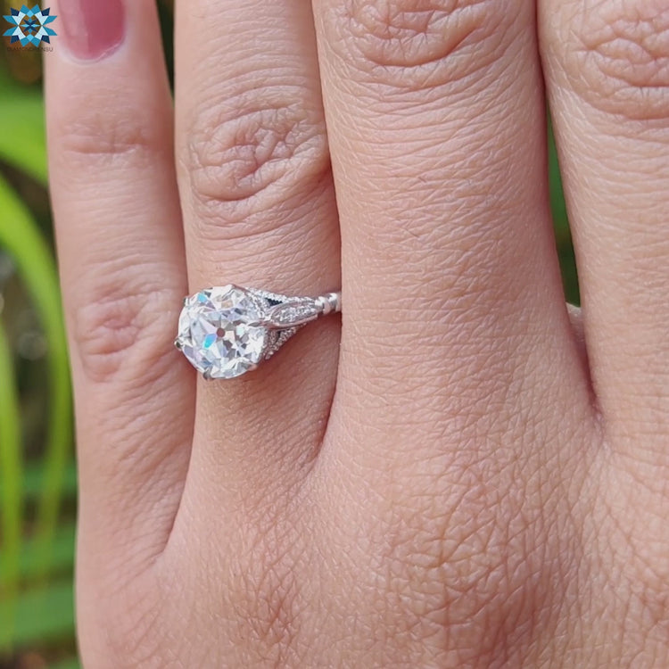 Side stone ring with vintage gold engagement ring for added sparkle.