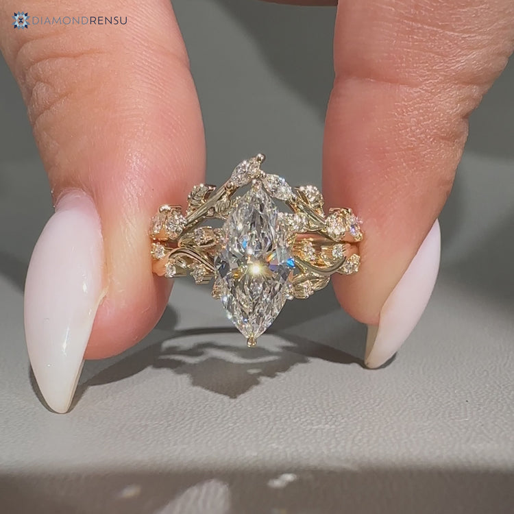 Nature inspired marquise bridal set with hidden round diamonds.