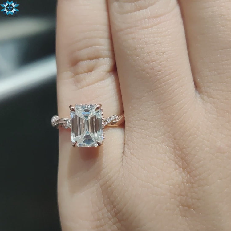 Diamondrensu UK emerald engagement ring in rose gold.
