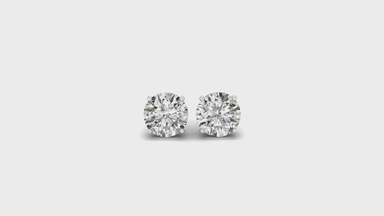 White gold prong earrings with round diamond fit.
