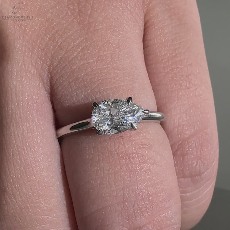 Engagement ring for women with a cathedral setting and pear diamond
