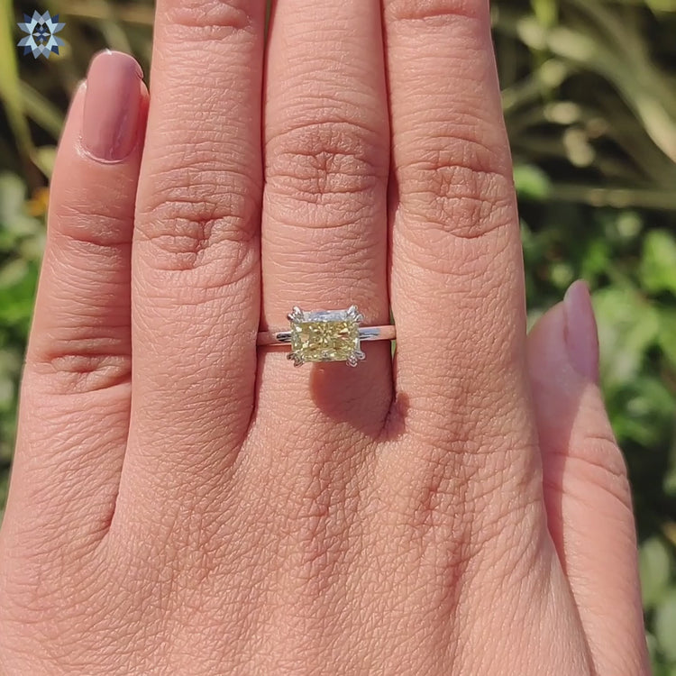 Custom engagement ring with pale yellow moissanite.
