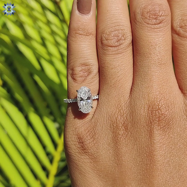 Moval cut moissanite ring with prong and claw prong settings.
