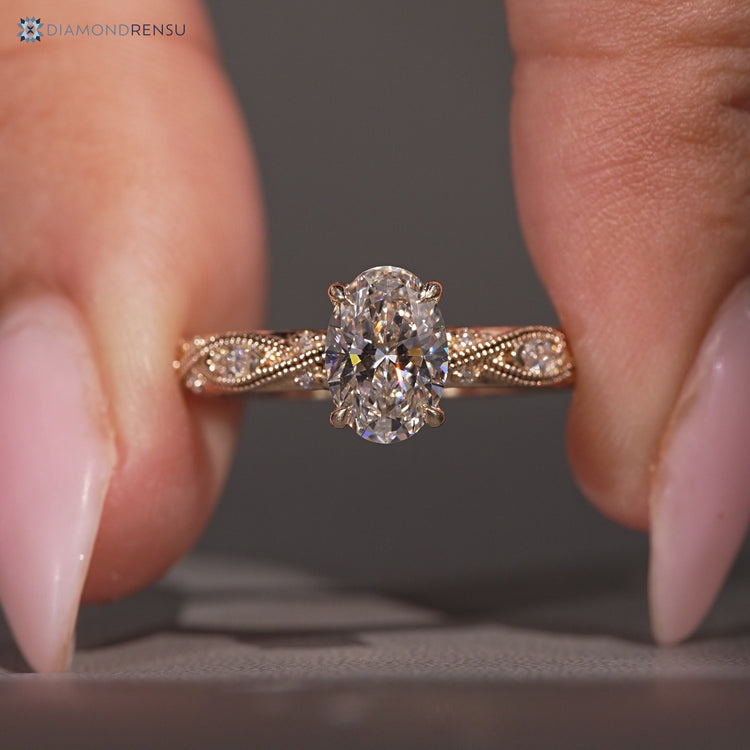Oval cut ring with Art Deco style and milgrain details.