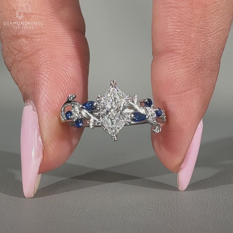 Marquise diamond ring featuring leaf style prong setting.
