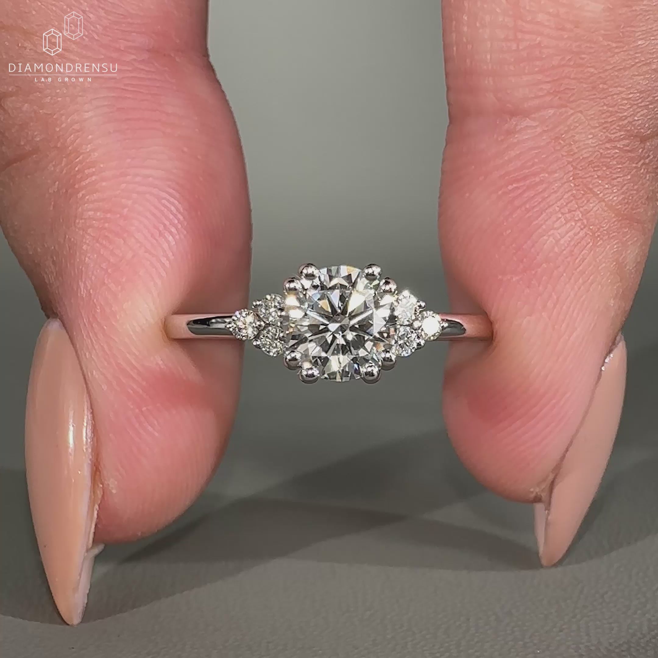 Custom engagement ring featuring round diamond in double prong setting.
