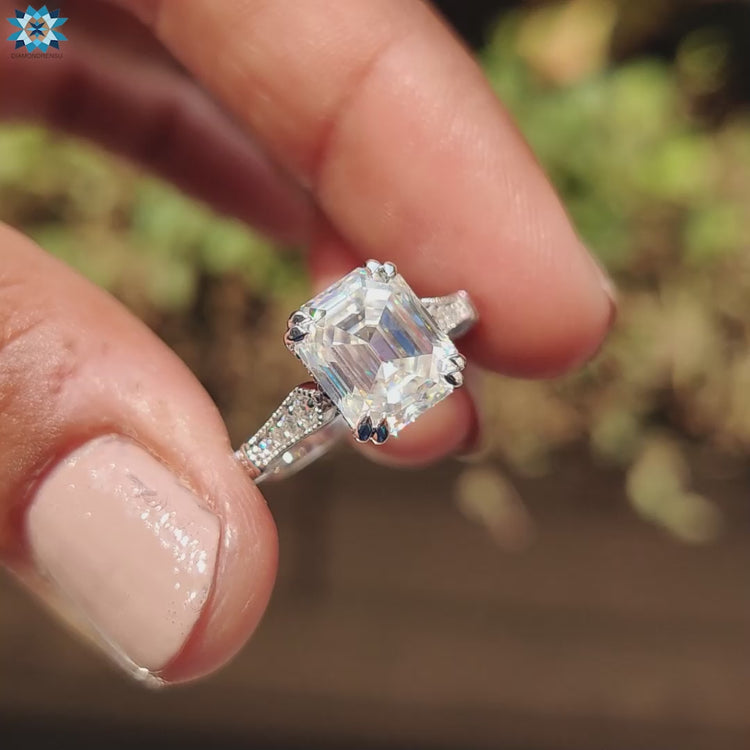 Vintage moissanite ring with milgrain detailing and handmade white gold band.
