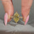 Yellow Dutch marquise cut diamond with solitaire style setting.