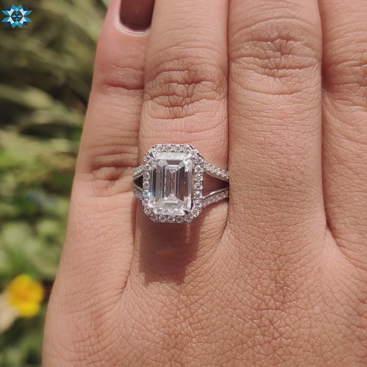 Moissanite ring with a split shank and halo design.
