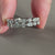 White gold half eternity wedding band with prong setting

