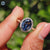White gold engagement ring featuring oval blue moissanite and 4 claw prong setting.
