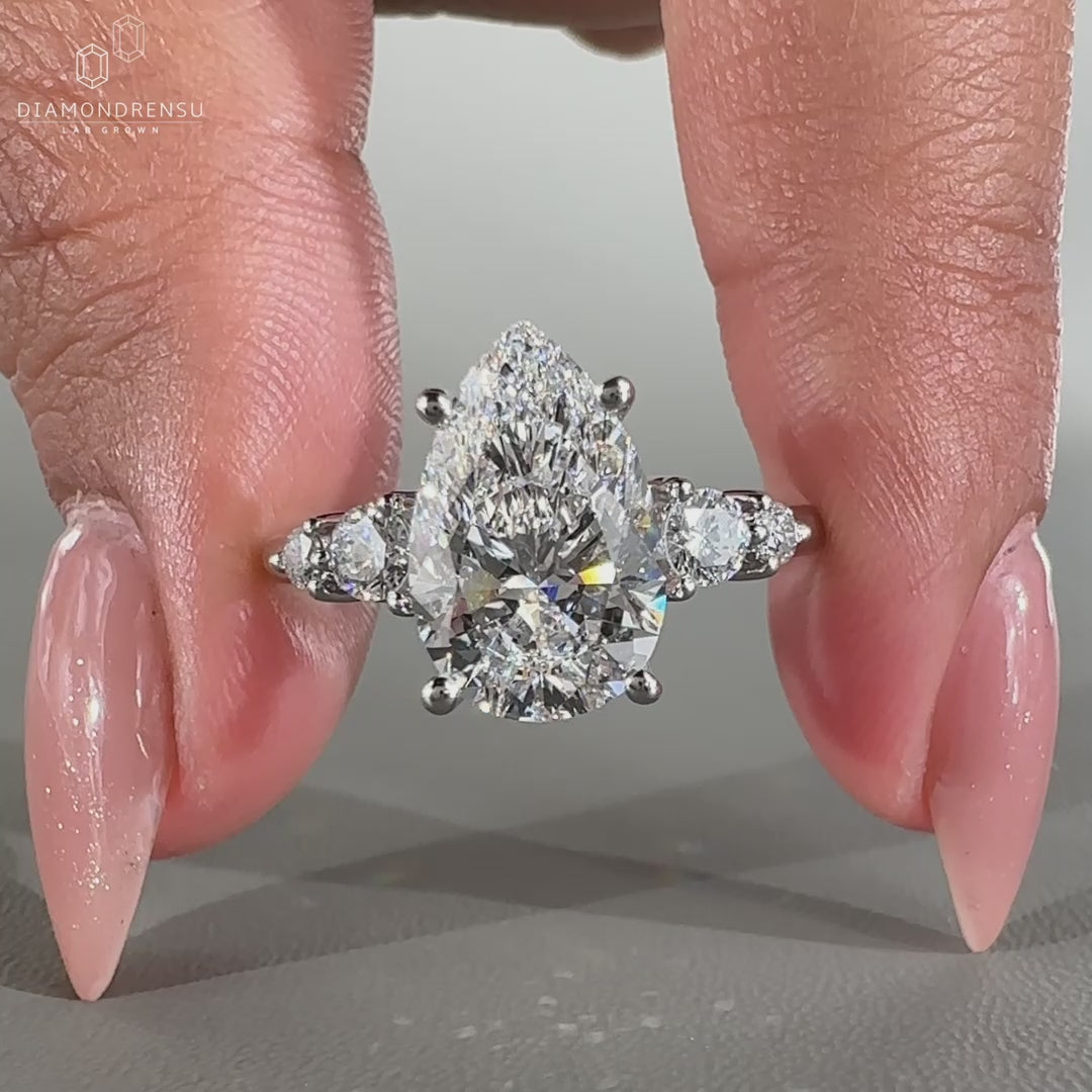 White gold ring featuring prong setting and custom diamond design.
