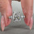 White gold ring featuring prong setting and custom diamond design.
