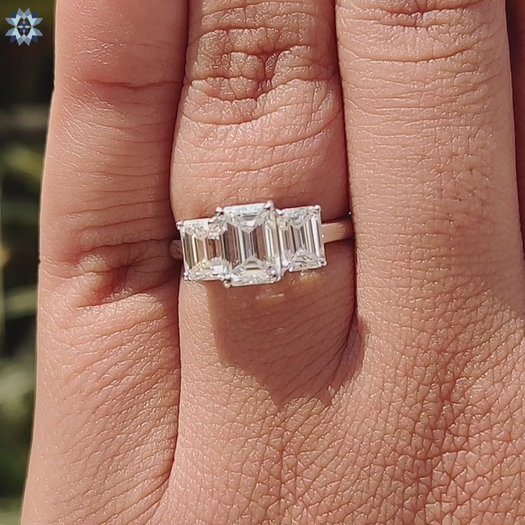 Custom engagement ring with emerald moissanite stones.
