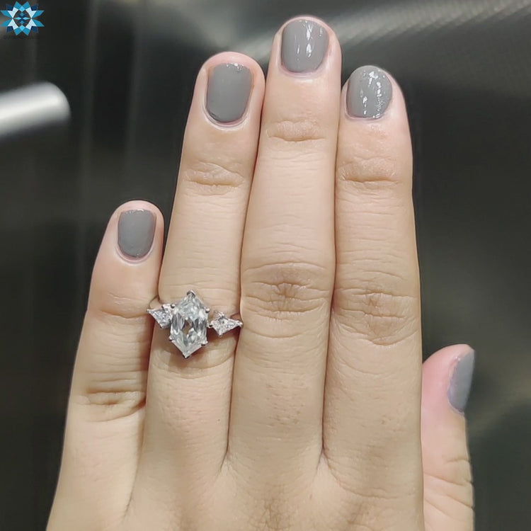 Buy moissanite ring designed with elongated hexagon and kite cut stones in white gold.
