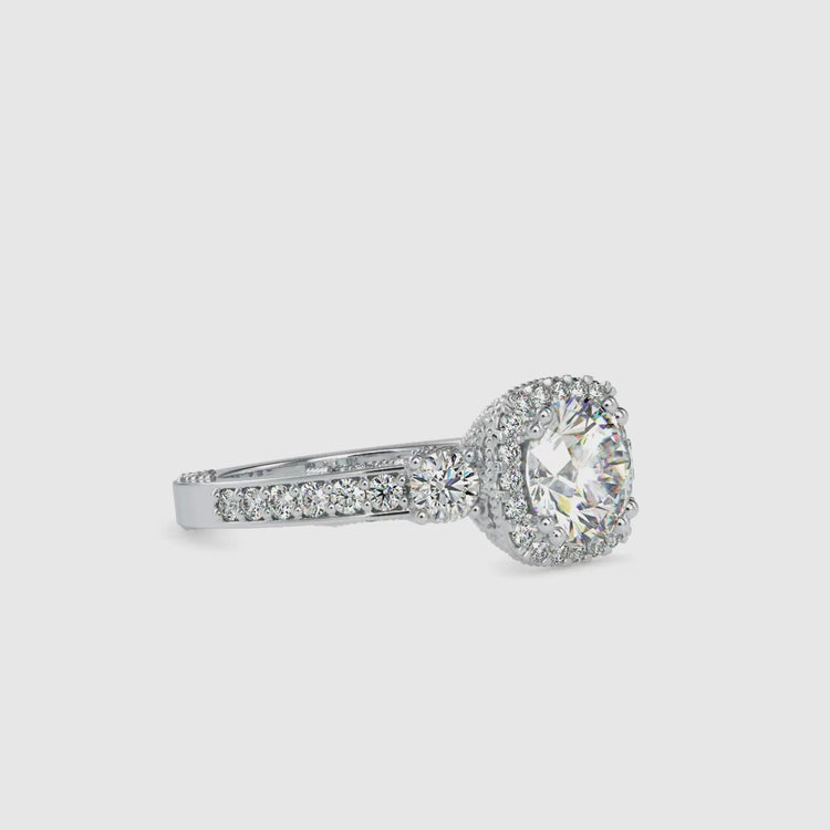 Diamondrensu UK engagement ring with round diamond trio.

