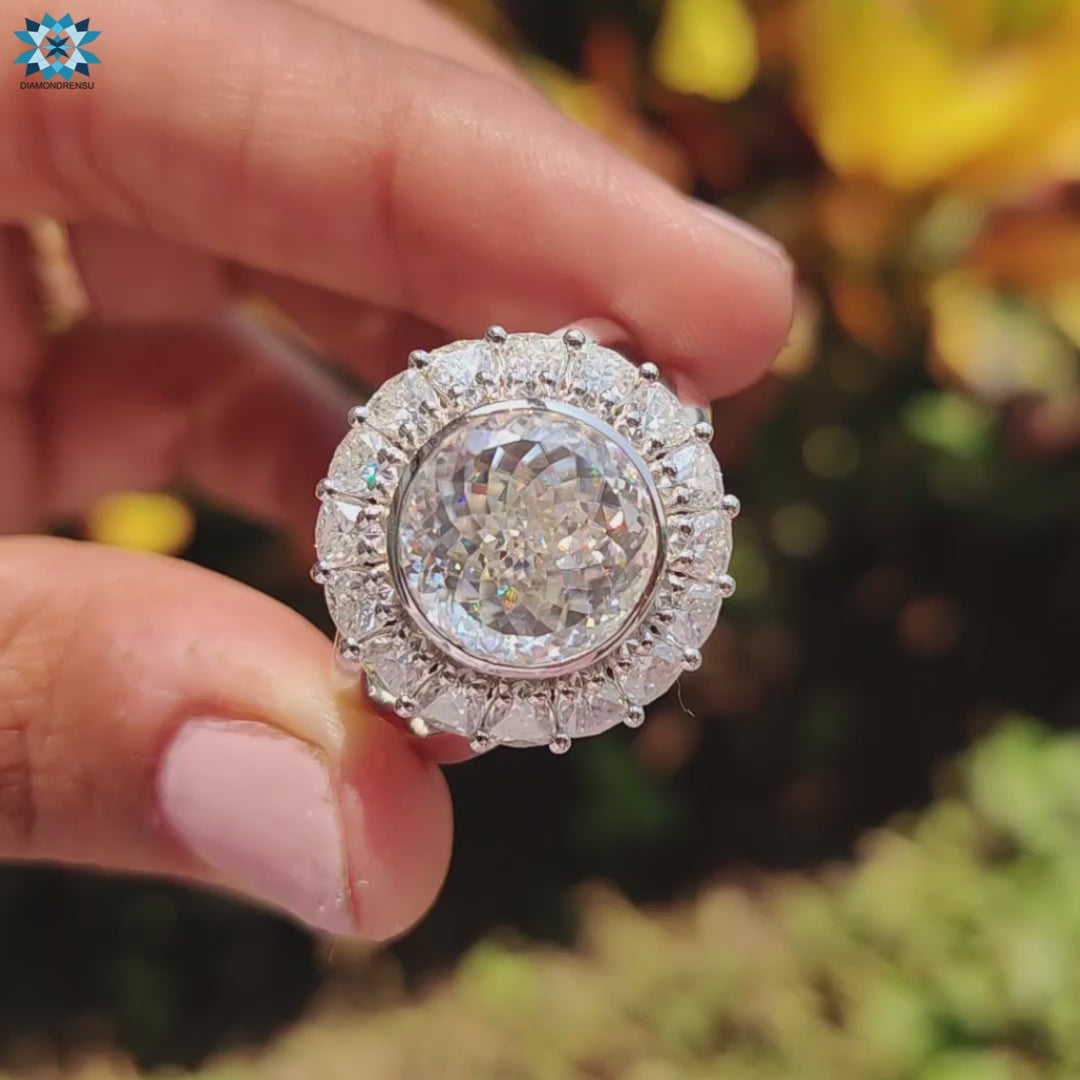 Trillion cut halo ring in white gold with vintage styling.
