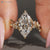 Nature inspired marquise ring with cluster setting style.