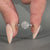 Round cut diamond ring in a classic design.
