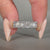 Six stone wedding band offering elegant sparkle.
