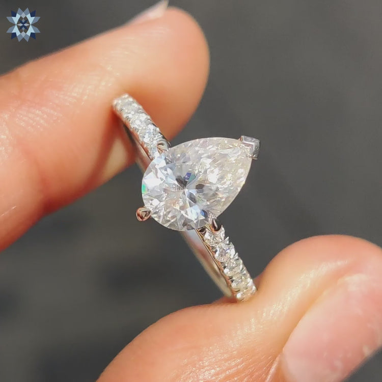 Moissanite pave ring with round cut band and white gold setting.
