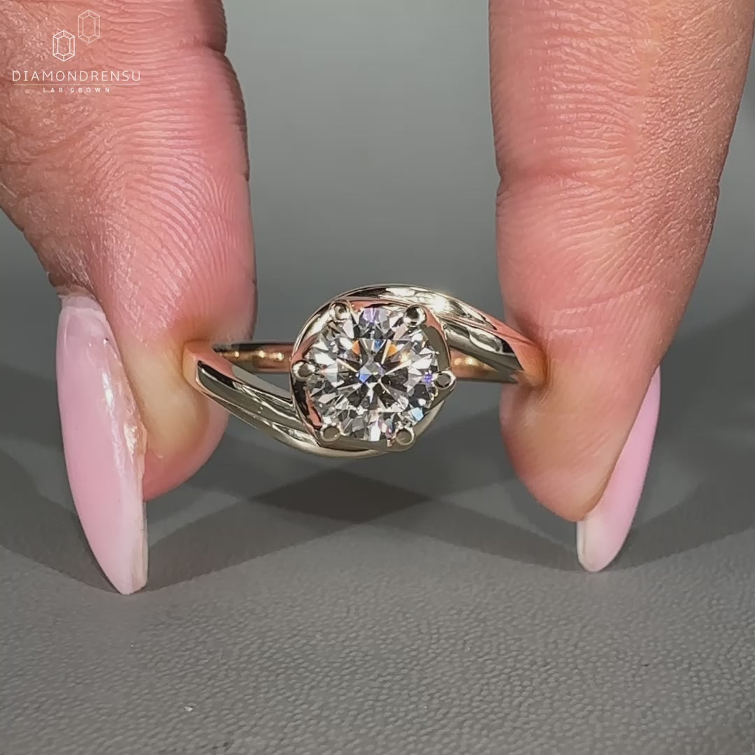 Solitaire engagement ring featuring six prong setting.
