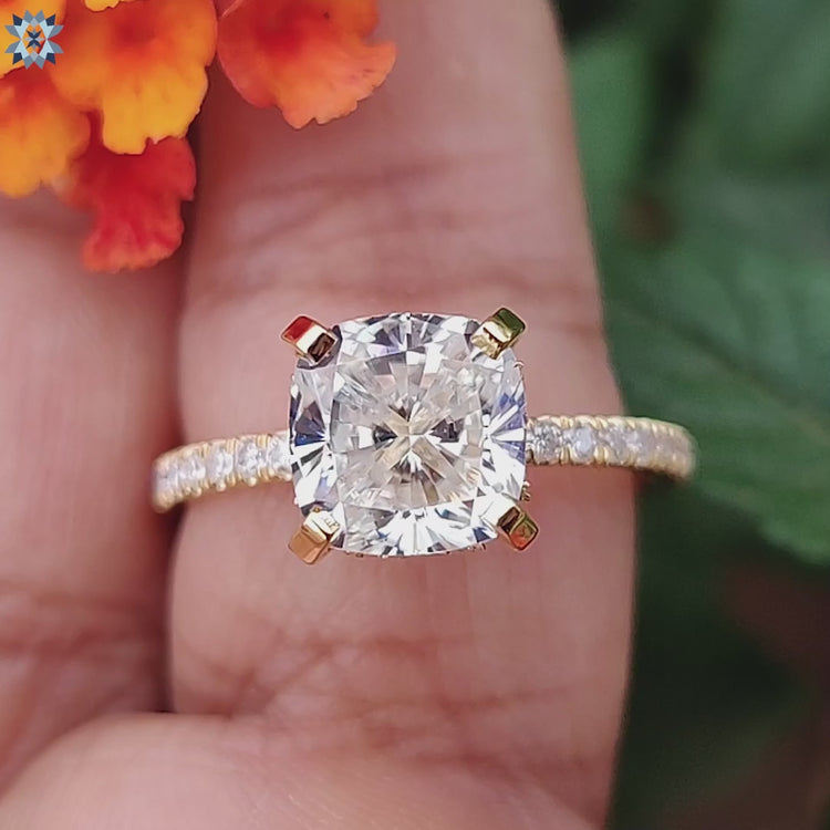 Handmade ring in yellow gold with cushion moissanite and pave band.
