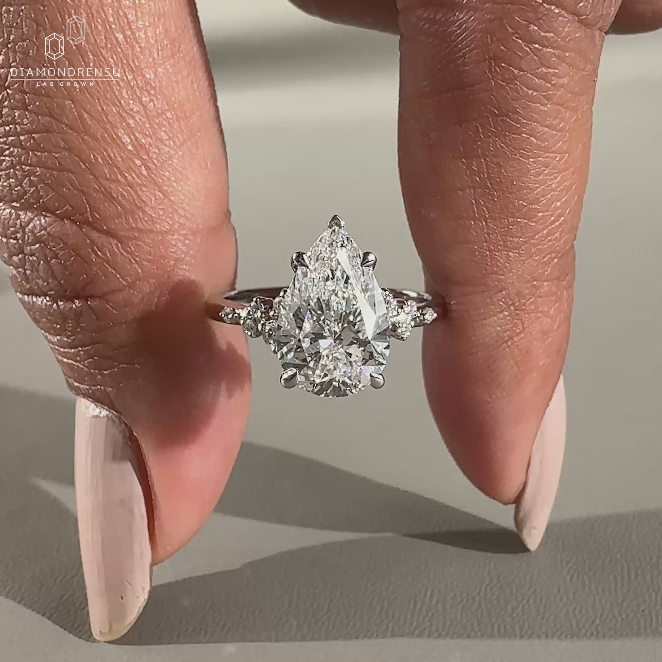 Round diamond ring featuring white gold ring
