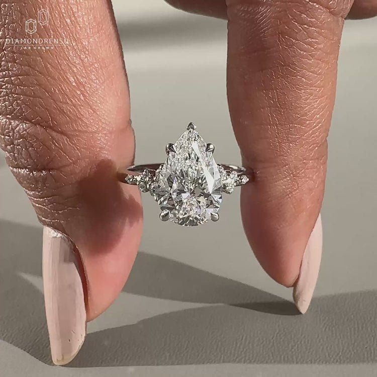 Round diamond ring featuring white gold ring

